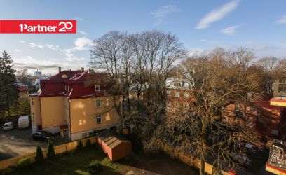 Pilte Hubane korter ajaloolises majas. Vaade vanalinnale